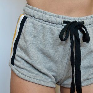 Plush shorts with lateral stripes